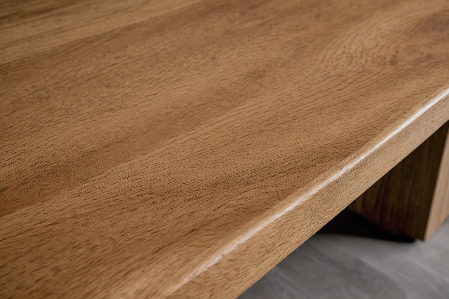 Solid oak dining table edge showing end grain