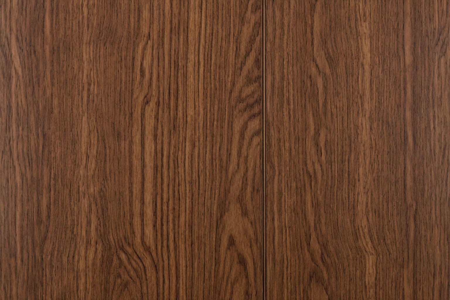 Book-matched walnut veneer grain on a table top